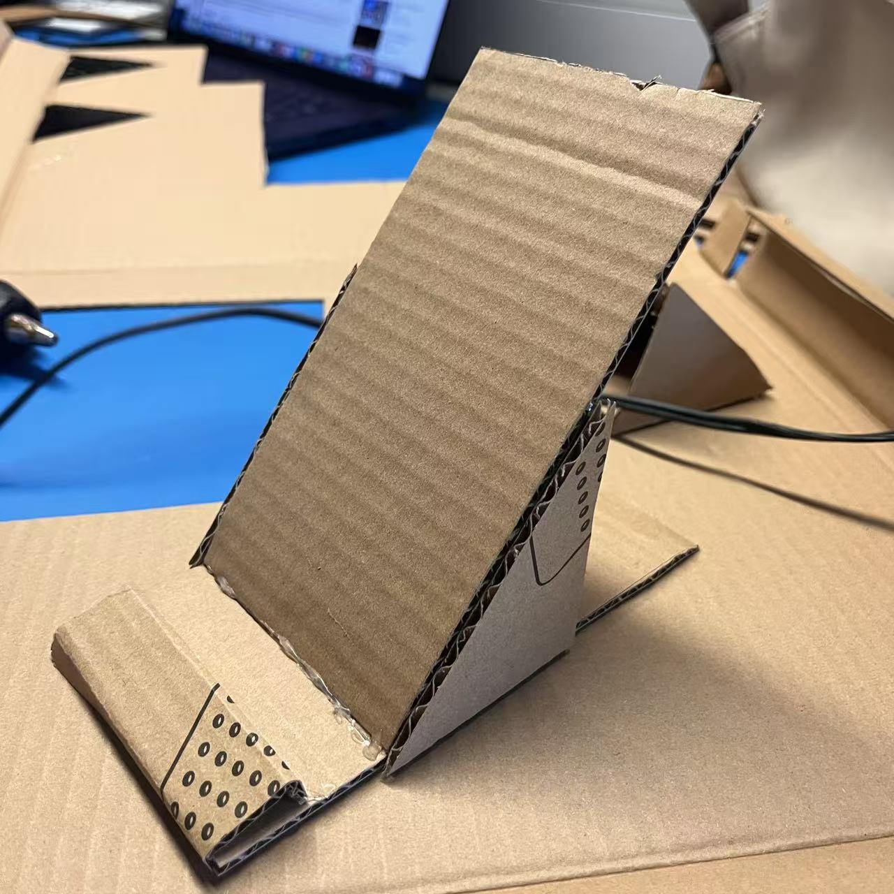 Refining the vertical stand and adding a stronger back angle for better balance.